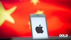 iPhone sales in China as shown by a phone and a flag