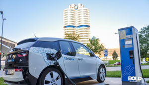 global electric vehicle market as shown by a charging car