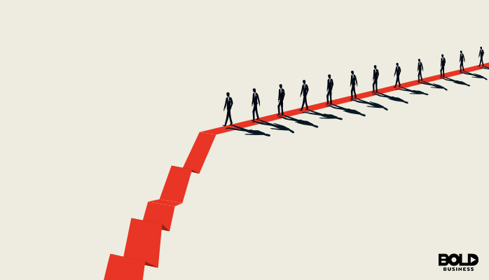 a graphic showing employees falling down stairs