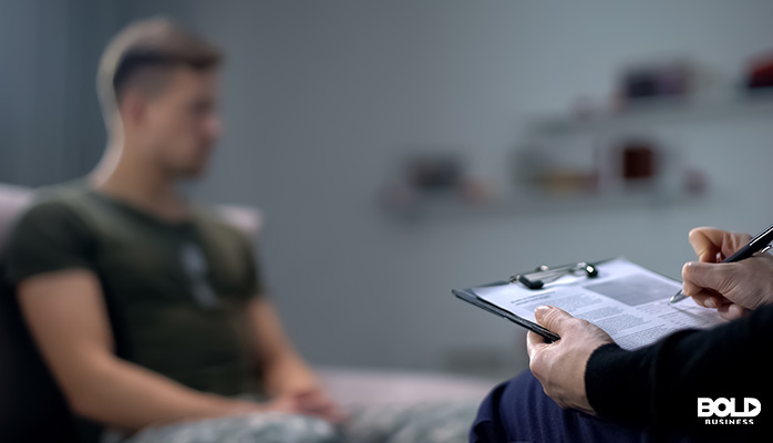 a soldier talking to a head shrinker