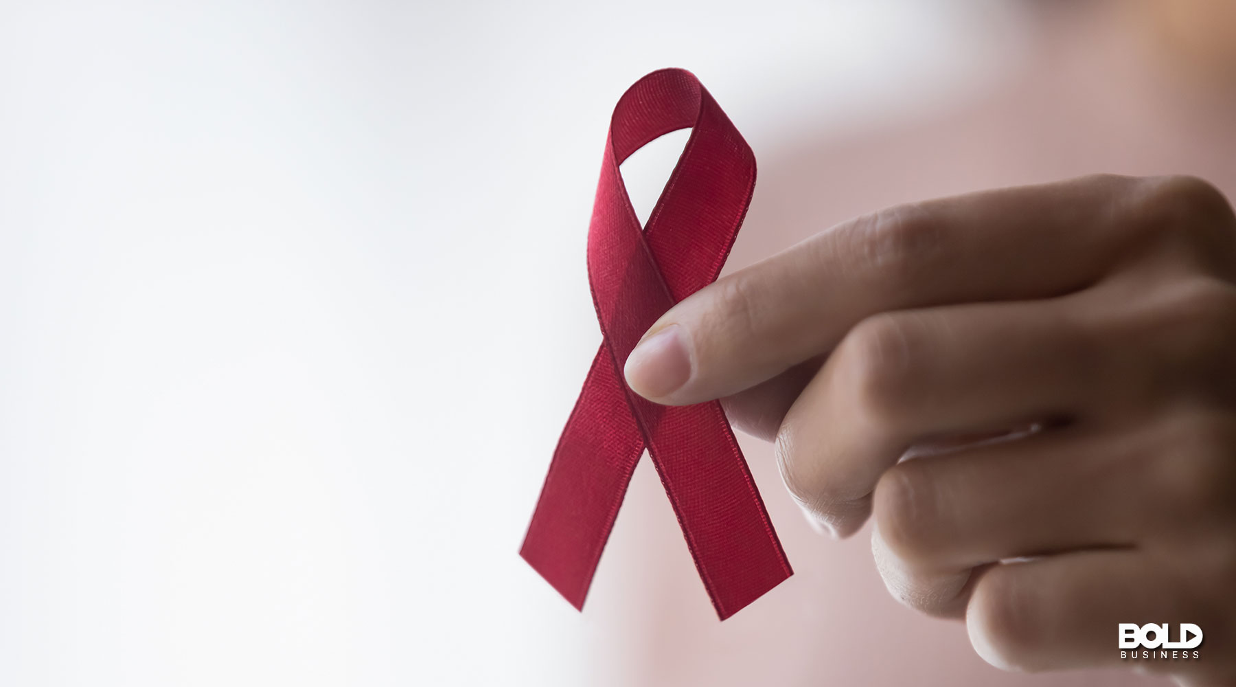 a ribbon showing access to effective HIV treatment