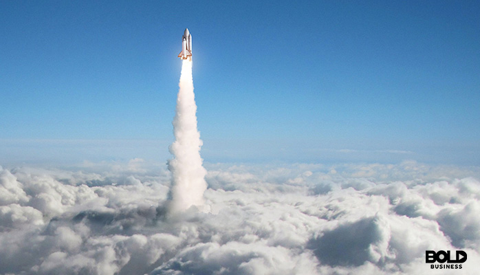 a rocket taking off through the clouds