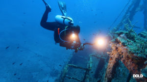 a diver doing underwater drone sea-mapping
